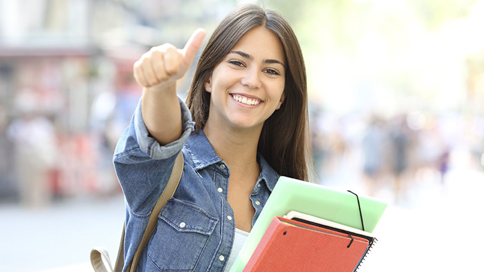 NC real estate license girl holding a books 