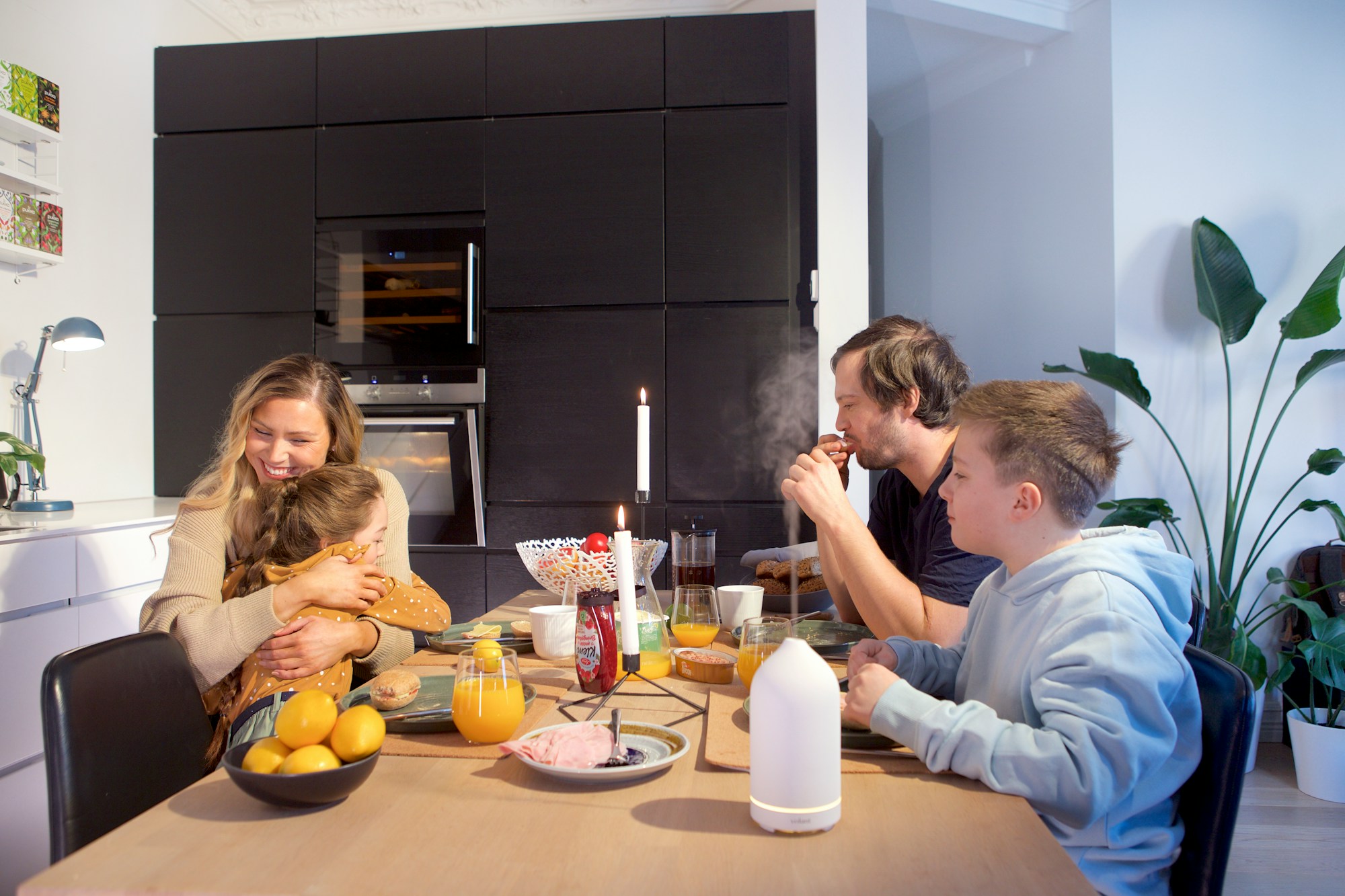 Family enjoying together in a multi-generational home with open floor plan