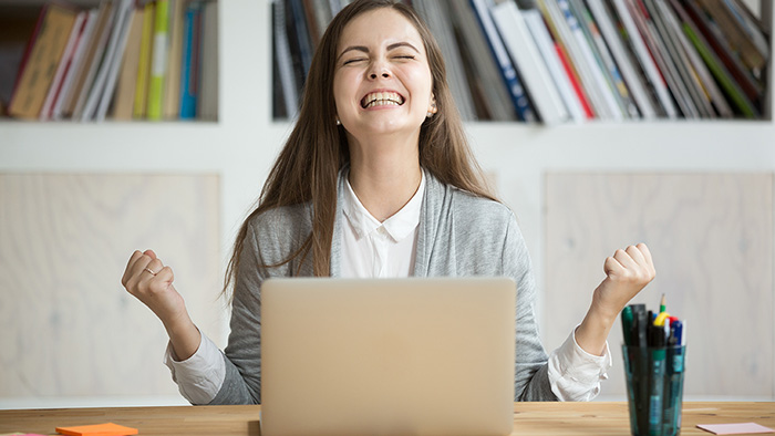 Happy girl with laptop.